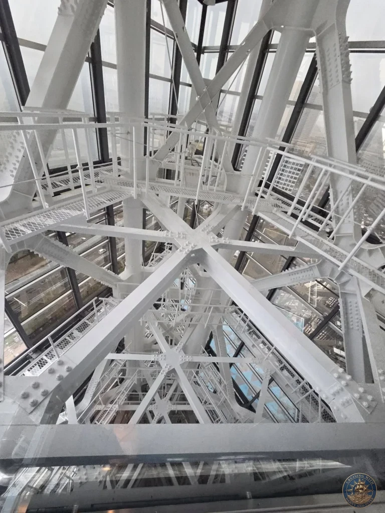 Complex white steel framework and staircases inside Fukuoka Tower, Japan. Architectural engineering view. Fukuoka Cruise Port Guide | Things to do in Fukuoka from cruise ship | One day in Fukuoka Japan itinerary by Danny and Peter.