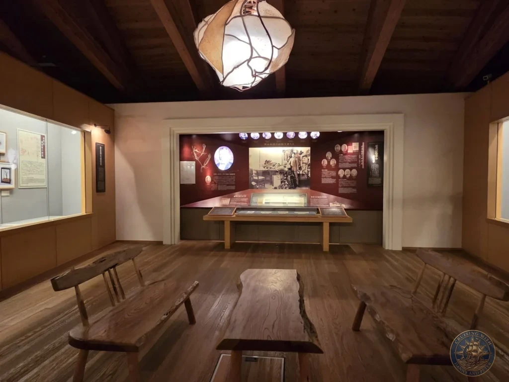 Exhibition space dedicated to Tomitaro Makino featuring wooden furniture and historical displays at Makino Botanical Garden in Kochi, Japan. Kochi Cruise Port Guide | Things to do in Kochi from cruise ship | One day in Kochi Japan itinerary by Danny and Peter.