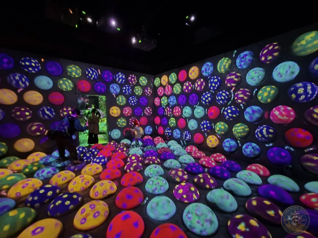 Immersive room of colorful glowing interactive spheres at teamLab Forest Fukuoka, Japan. Digital art experience. Fukuoka Cruise Port Guide | Things to do in Fukuoka from cruise ship | One day in Fukuoka Japan itinerary by Danny and Peter.