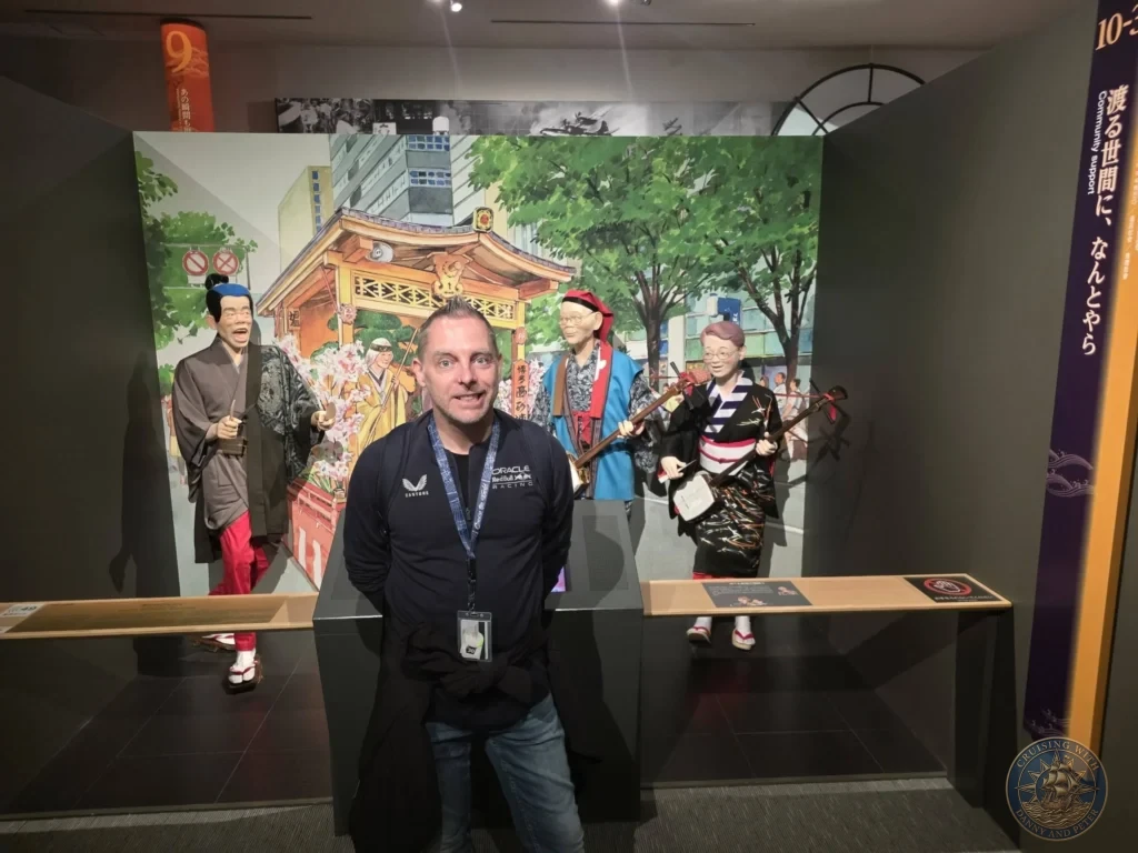 Peter posing with traditional Yamakasa festival mannequins at Fukuoka City Museum, Japan. Cultural exhibit. Fukuoka Cruise Port Guide | Things to do in Fukuoka from cruise ship | One day in Fukuoka Japan itinerary by Danny and Peter.