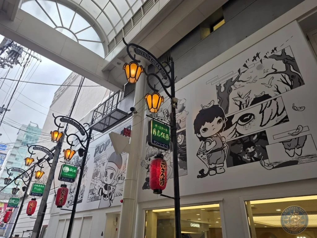 Kobe Japan Cruise Port Guide 2026 – Insider Tips & One Day Itinerary 97 Covered shopping street Hozenji Koisan Dori in Osaka featuring decorative lanterns, street lamps, and large manga-style wall murals. Atmospheric Osaka alley from Kobe port day. Kobe Japan Cruise Port Guide | DIY Kobe Cruise Port to City Center | Things to do in Kobe from cruise ship | Westerdam Kobe Docking Location | One day in Kobe Japan itinerary by Danny and Peter.