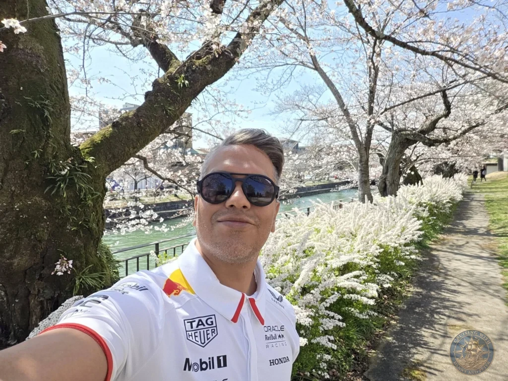 Kobe Japan Cruise Port Guide 2026 – Insider Tips & One Day Itinerary 51 Danny taking a selfie along the canal path lined with cherry blossoms near Heian Shrine in Kyoto, Japan. Spring day from Kobe port. Kobe Japan Cruise Port Guide | DIY Kobe Cruise Port to City Center | Things to do in Kobe from cruise ship | Westerdam Kobe Docking Location | One day in Kobe Japan itinerary by Danny and Peter.