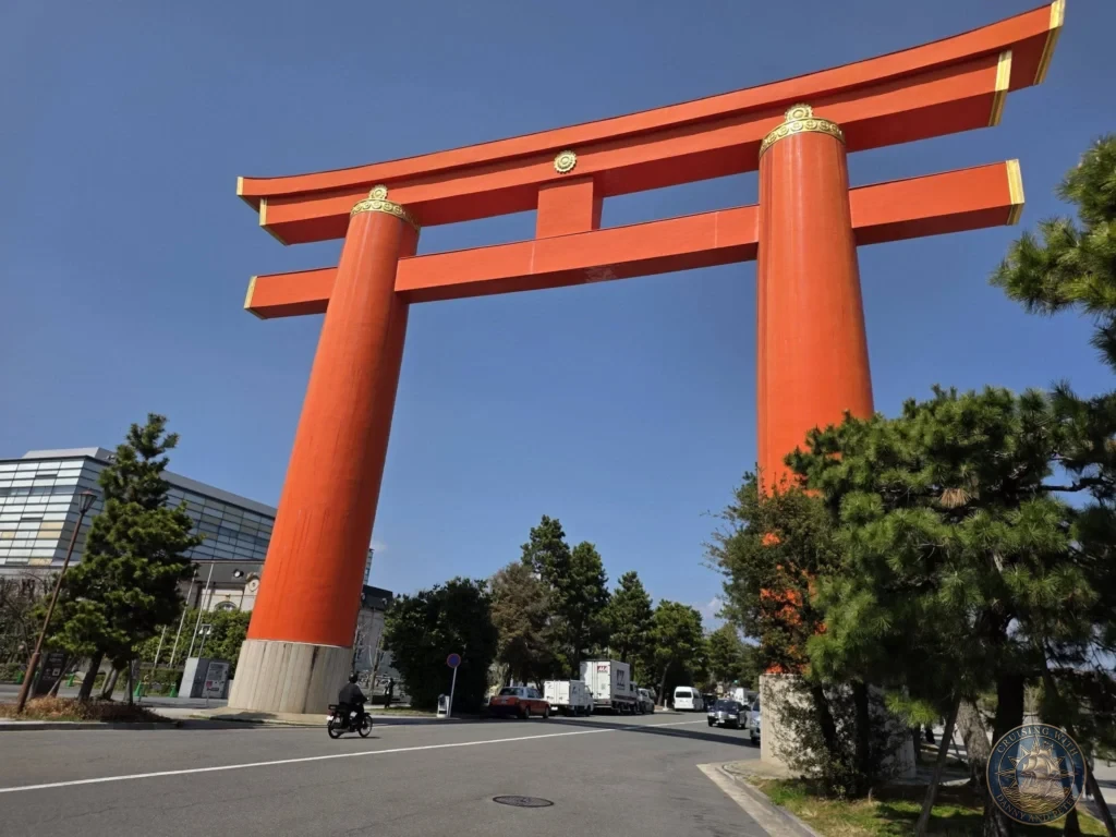 Kobe Japan Cruise Port Guide 2026 – Insider Tips & One Day Itinerary 37 Large orange torii gate of Heian Shrine standing tall against a clear blue sky in Kyoto, Japan. Landmark view from Kobe port day. Kobe Japan Cruise Port Guide | DIY Kobe Cruise Port to City Center | Things to do in Kobe from cruise ship | Westerdam Kobe Docking Location | One day in Kobe Japan itinerary by Danny and Peter.