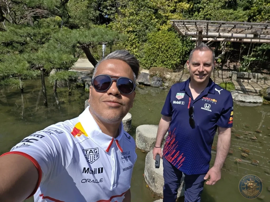 Kobe Japan Cruise Port Guide 2026 – Insider Tips & One Day Itinerary 56 Danny and Peter taking a selfie by the pond in the gardens of Heian Shrine under bright sunlight in Kyoto, Japan. Shrine gardens from Kobe port day. Kobe Japan Cruise Port Guide | DIY Kobe Cruise Port to City Center | Things to do in Kobe from cruise ship | Westerdam Kobe Docking Location | One day in Kobe Japan itinerary by Danny and Peter.