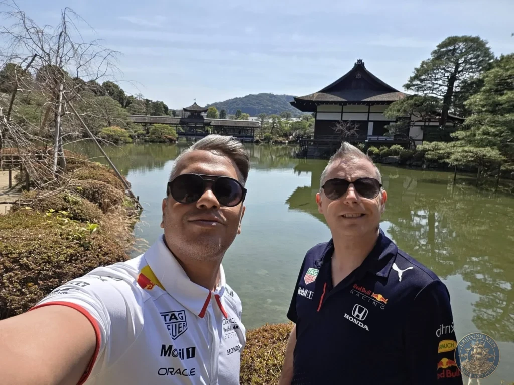 Kobe Japan Cruise Port Guide 2026 – Insider Tips & One Day Itinerary 148 Danny and Peter taking a selfie in front of the pond and traditional buildings in the gardens of Heian Shrine under a blue sky in Kyoto, Japan. Shrine gardens from Kobe port day. Kobe Japan Cruise Port Guide | DIY Kobe Cruise Port to City Center | Things to do in Kobe from cruise ship | Westerdam Kobe Docking Location | One day in Kobe Japan itinerary by Danny and Peter.