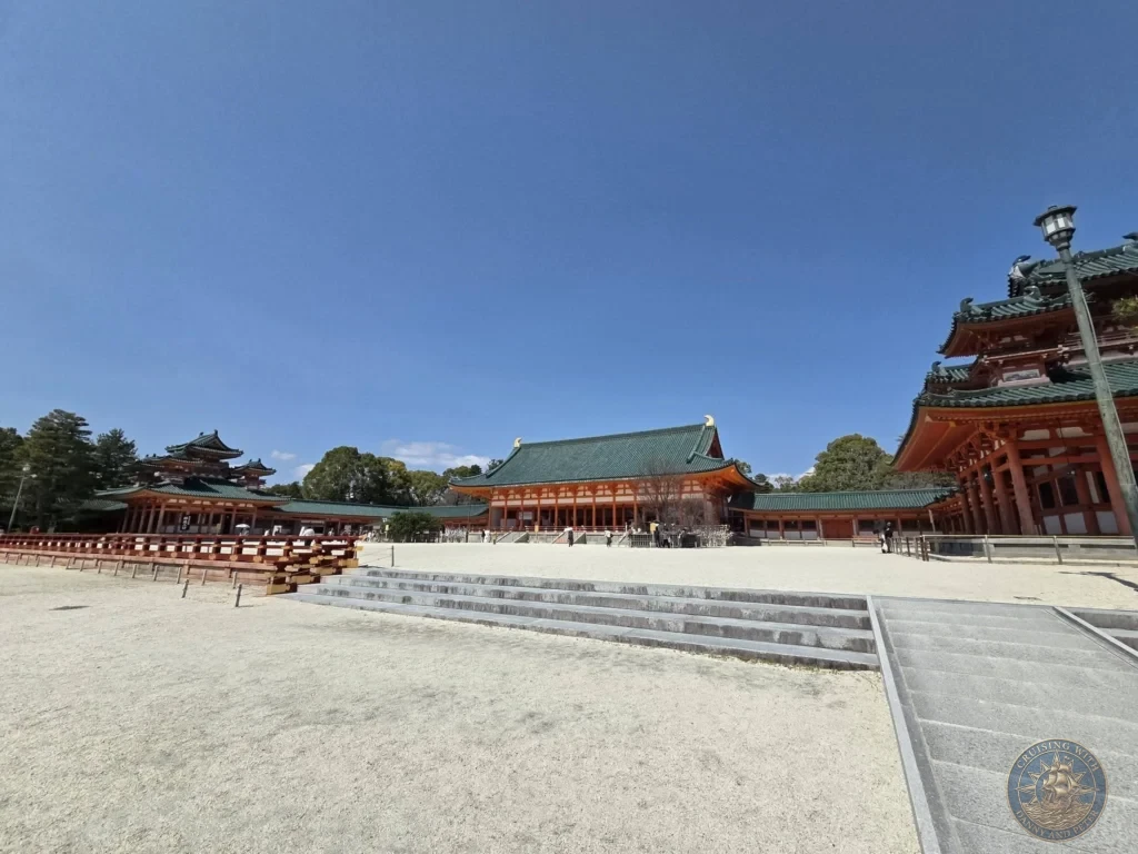 Kobe Japan Cruise Port Guide 2026 – Insider Tips & One Day Itinerary 64 Wide view of the spacious main courtyard with red and green traditional buildings of Heian Shrine under a clear blue sky in Kyoto, Japan. Iconic shrine architecture from Kobe port day. Kobe Japan Cruise Port Guide | DIY Kobe Cruise Port to City Center | Things to do in Kobe from cruise ship | Westerdam Kobe Docking Location | One day in Kobe Japan itinerary by Danny and Peter.