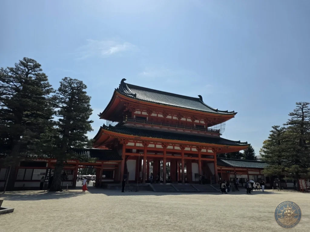 Kobe Japan Cruise Port Guide 2026 – Insider Tips & One Day Itinerary 66 The grand two-story vermilion main gate of Heian Shrine with green roofs under a clear blue sky in Kyoto, Japan. Iconic shrine architecture from Kobe port day. Kobe Japan Cruise Port Guide | DIY Kobe Cruise Port to City Center | Things to do in Kobe from cruise ship | Westerdam Kobe Docking Location | One day in Kobe Japan itinerary by Danny and Peter.