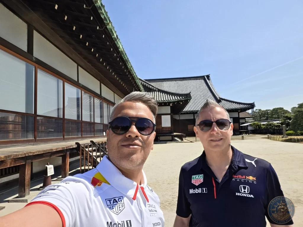 Kobe Japan Cruise Port Guide 2026 – Insider Tips & One Day Itinerary 73 Danny and Peter taking a selfie in front of the traditional wooden buildings of Nijo Castle in Kyoto, Japan. Historic castle visit from Kobe. Kobe Japan Cruise Port Guide | DIY Kobe Cruise Port to City Center | Things to do in Kobe from cruise ship | Westerdam Kobe Docking Location | One day in Kobe Japan itinerary by Danny and Peter.