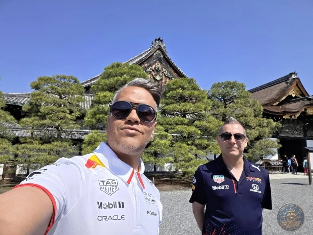 Kobe Japan Cruise Port Guide 2026 – Insider Tips & One Day Itinerary 74 Danny and Peter taking a selfie in front of traditional buildings and pine trees at Nijo Castle in Kyoto, Japan. Historic site from Kobe port day. Kobe Japan Cruise Port Guide | DIY Kobe Cruise Port to City Center | Things to do in Kobe from cruise ship | Westerdam Kobe Docking Location | One day in Kobe Japan itinerary by Danny and Peter.
