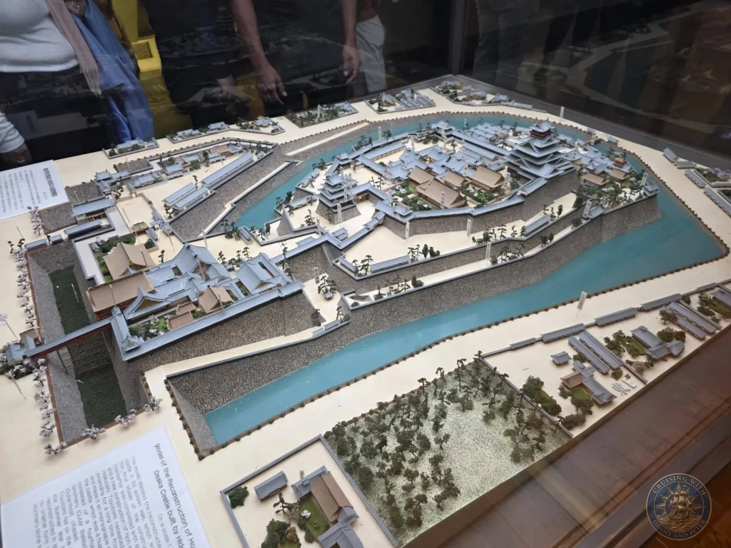 Kobe Japan Cruise Port Guide 2026 – Insider Tips & One Day Itinerary 105 Detailed scale model of the reconstruction of Osaka Castle built by Toyotomi Hideyoshi displayed inside the castle museum in Osaka, Japan. Historic exhibit from Kobe port day. Kobe Japan Cruise Port Guide | DIY Kobe Cruise Port to City Center | Things to do in Kobe from cruise ship | Westerdam Kobe Docking Location | One day in Kobe Japan itinerary by Danny and Peter.