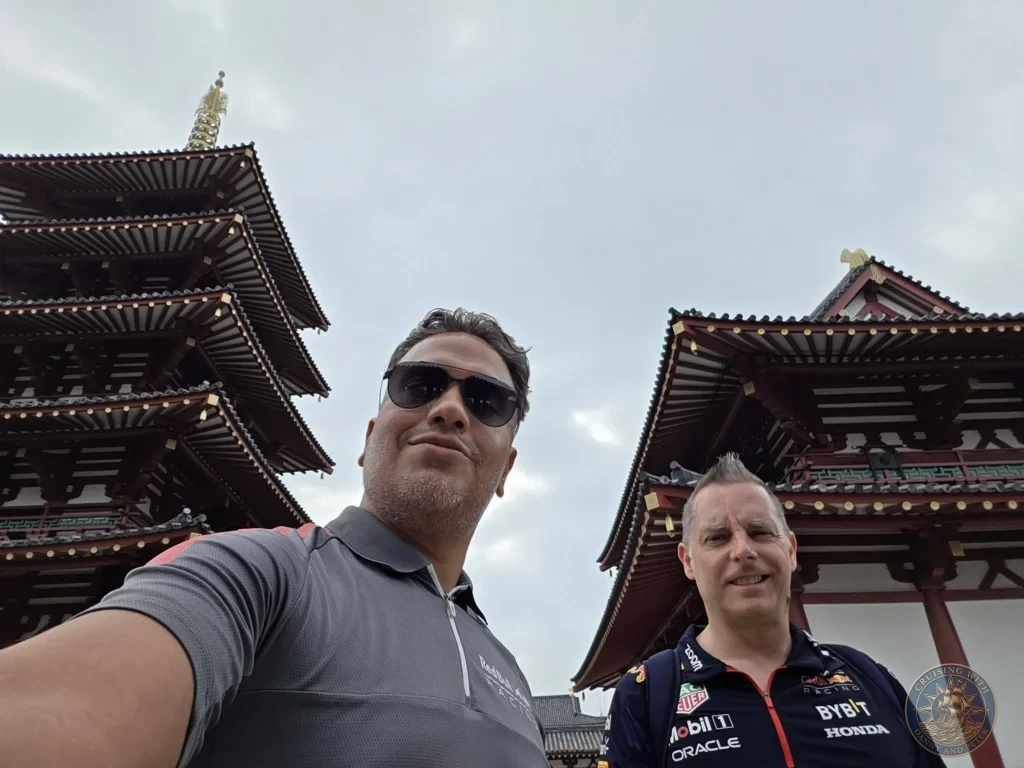 Kobe Japan Cruise Port Guide 2026 – Insider Tips & One Day Itinerary 159 Danny and Peter taking a low-angle selfie between the five-story pagoda and Kondo Main Hall at Shitennoji Temple in Osaka, Japan; ideal for a Kobe Japan Cruise Port Guide, DIY Kobe Cruise Port to City Center, Things to do in Kobe from cruise ship, MS Westerdam Kobe Docking Location, or One day in Kobe Japan itinerary, by Danny and Peter.