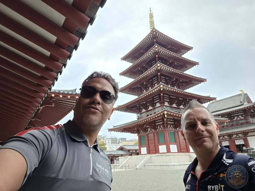 Kobe Japan Cruise Port Guide 2026 – Insider Tips & One Day Itinerary 36 Danny and Peter smiling together during a selfie in front of the five-story pagoda at Shitennoji Temple in Osaka, Japan; ideal for a Kobe Japan Cruise Port Guide, DIY Kobe Cruise Port to City Center, Things to do in Kobe from cruise ship, MS Westerdam Kobe Docking Location, or One day in Kobe Japan itinerary, by Danny and Peter.