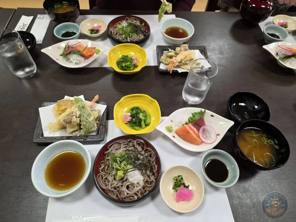 An elaborate traditional Japanese lunch set featuring cold izumo soba noodles, fresh sashimi, crisp tempura, side dishes, and misoshiru soup at Kyoragi restaurant in Matsue during a shore excursion from Sakaiminato Japan Cruise Port Guide, DIY Sakaiminato Cruise Port to City Center, Things to do in Sakaiminato from cruise ship, Westerdam Sakaiminato Docking Location, One day in Sakaiminato Japan itinerary by Danny and Peter.