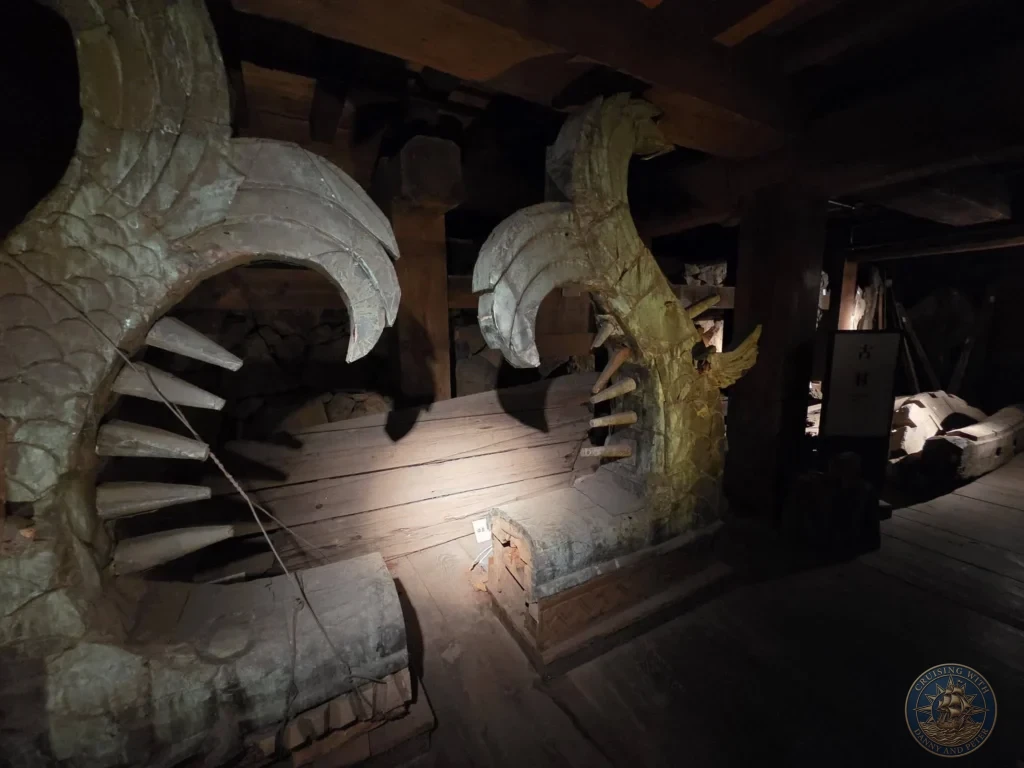 Two large wooden Shachihoko mythical fish roof ornaments displayed inside the dim wooden interior of Matsue Castle during a shore excursion from Sakaiminato Japan Cruise Port Guide, DIY Sakaiminato Cruise Port to City Center, Things to do in Sakaiminato from cruise ship, Westerdam Sakaiminato Docking Location, One day in Sakaiminato Japan itinerary by Danny and Peter.